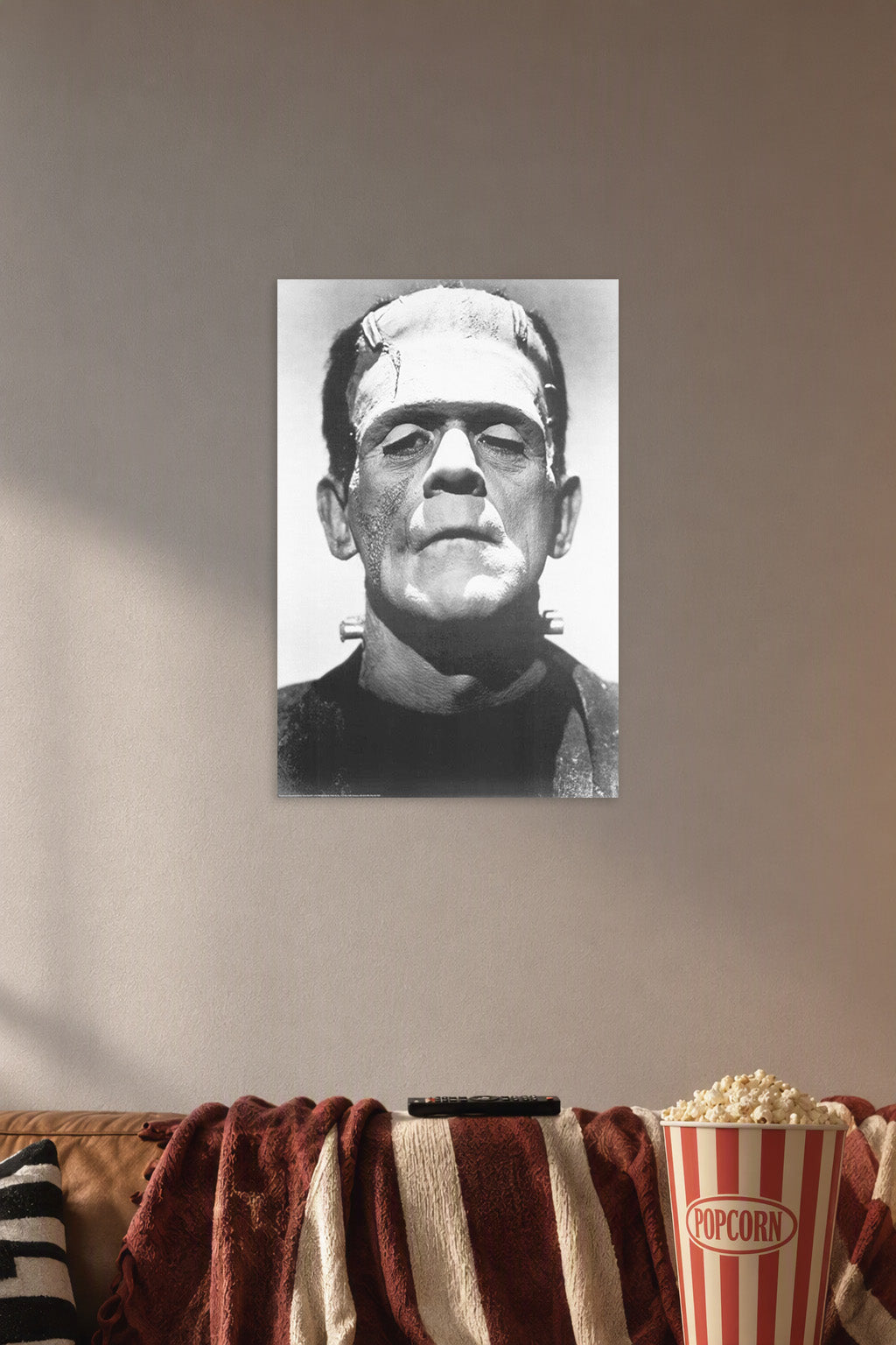 Frankenstein Boris Karloff B004008U2Q in a cozy movie room above a brown sofa with popcorn.