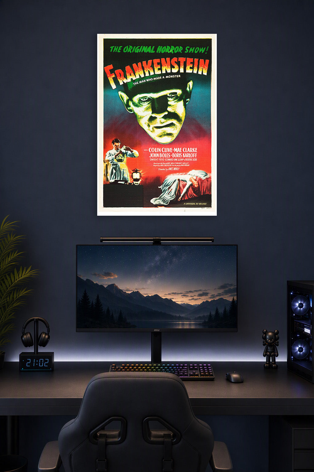 Frankenstein in a gaming desk setup above a monitor.