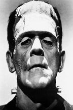 Frankenstein's Monster wall art print features a stark black-and-white close-up of the creature's scarred forehead and neck bolts.