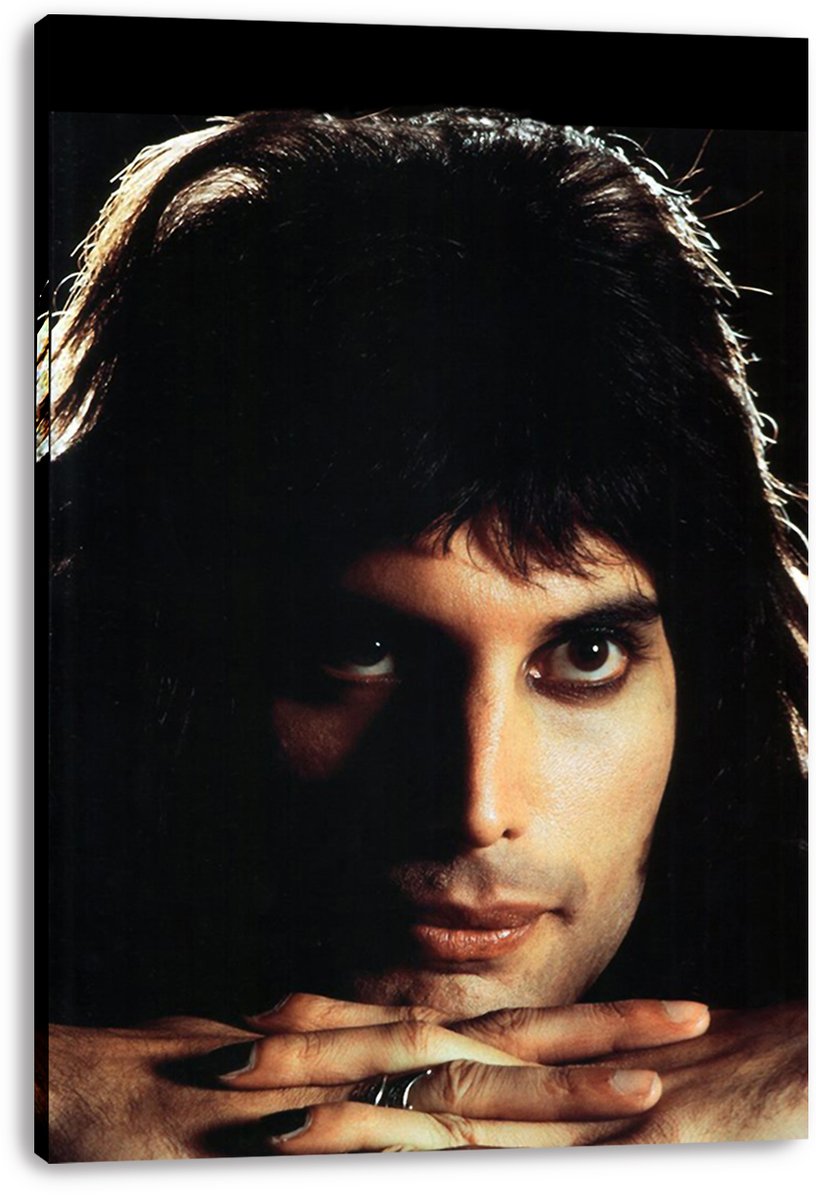 Freddie Mercury canvas wall art print displays his dramatic close-up portrait, dark hair, intense eyes, and folded hands.