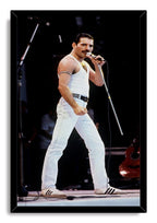 Freddie Mercury framed wall art print features the mustached singer in a white outfit performing with a microphone onstage.