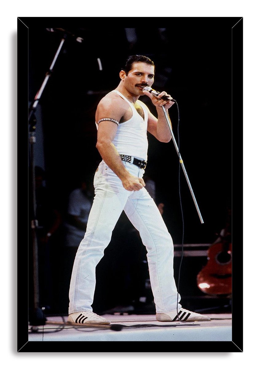 Freddie Mercury framed wall art print features the mustached singer in a white outfit performing with a microphone onstage.