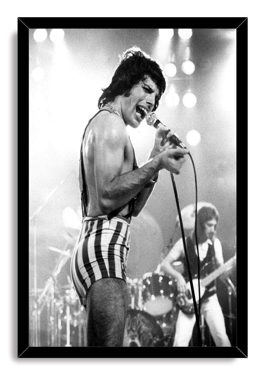 Freddie Mercury framed wall art print presents a monochrome concert scene of the singer with microphone and striped shorts.