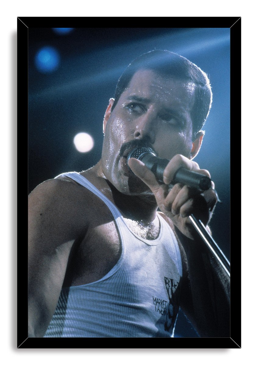 Freddie Mercury framed wall art print presents the singer performing into a microphone, set in a black mitered frame.