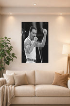 Freddie Mercury in a bright living room above a beige sofa.