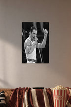 Freddie Mercury in a cozy movie room above a brown sofa with popcorn.