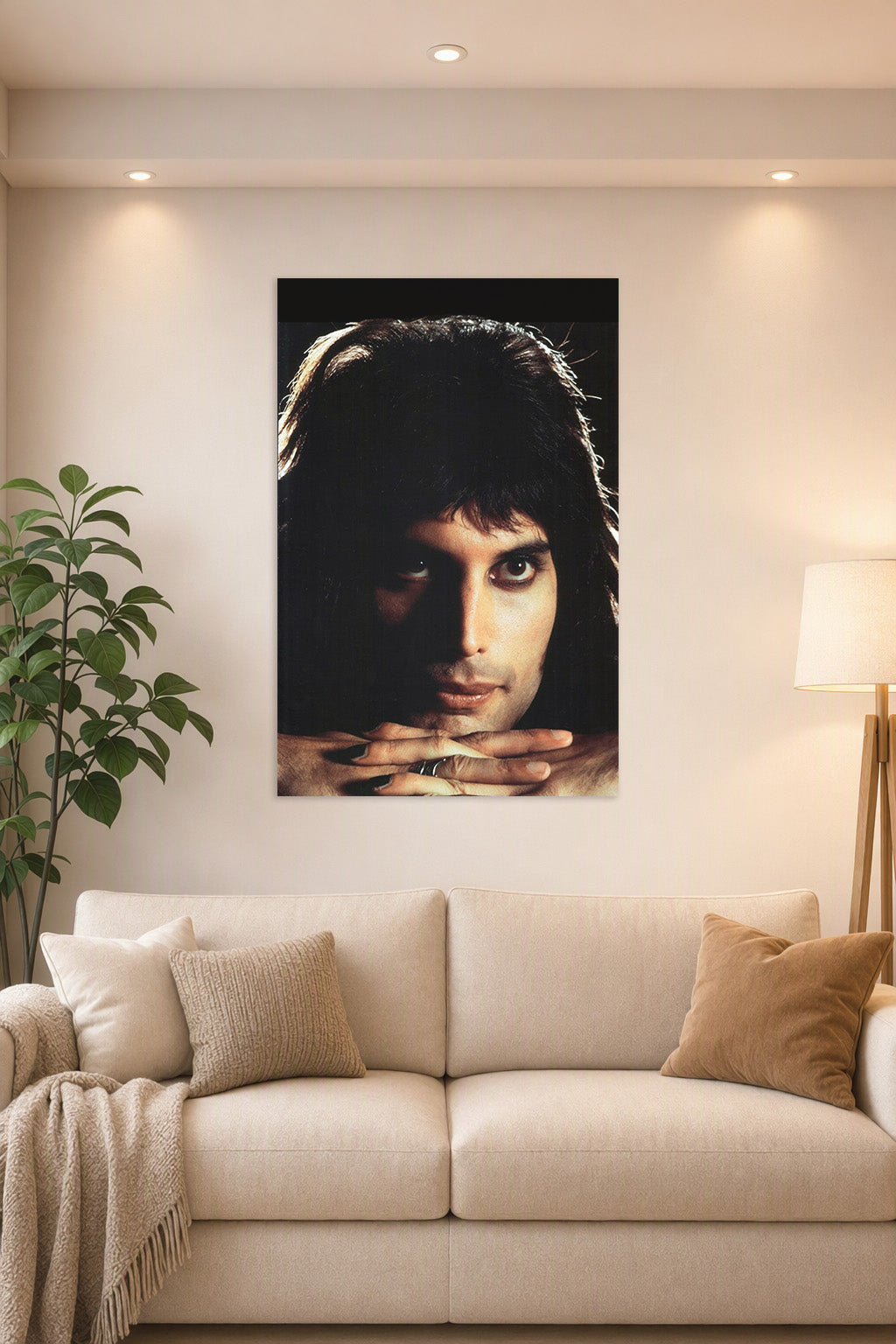 Freddie Mercury in a bright living room above a beige sofa.