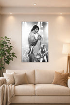 Freddie Mercury in a bright living room above a beige sofa.