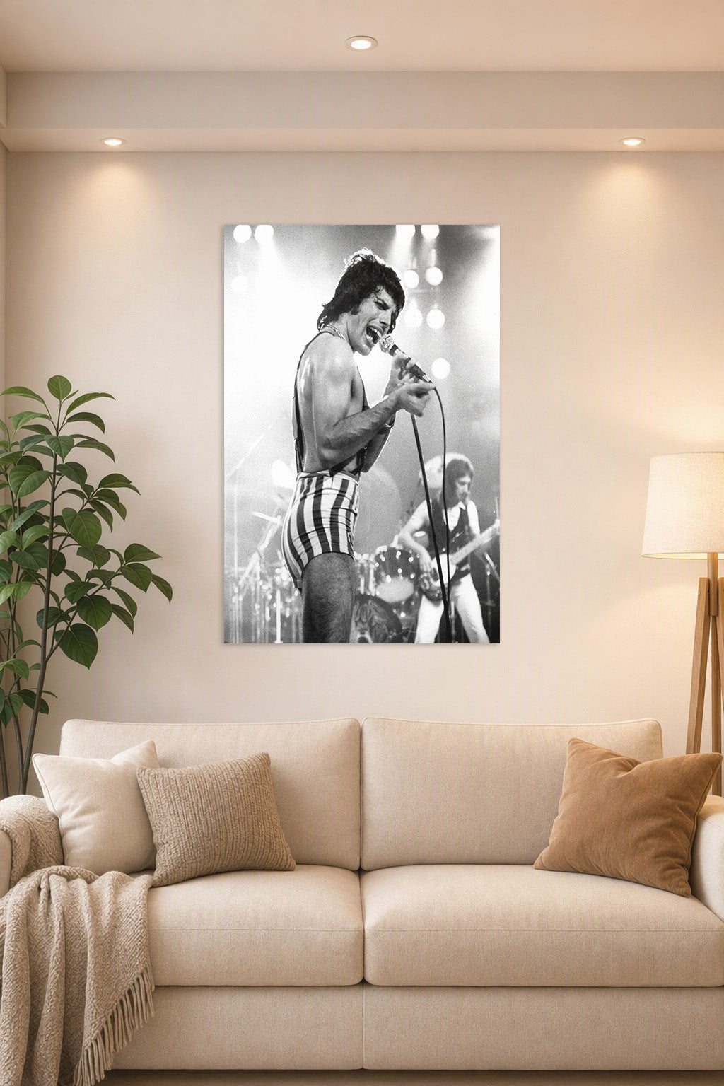 Freddie Mercury in a bright living room above a beige sofa.