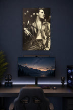 Freddie Mercury in a gaming desk setup above a monitor.