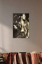 Freddie Mercury in a cozy movie room above a brown sofa with popcorn.