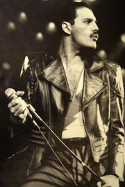Freddie Mercury poster in black and white, holding a microphone stand in a leather jacket beneath blurred stage lights.