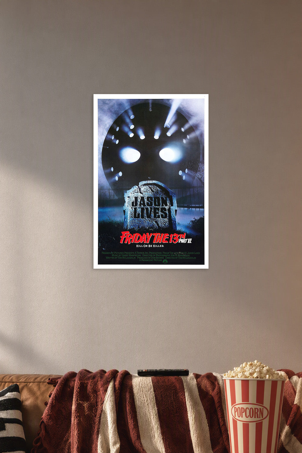 Friday the 13th Jason Lives Horror Movie in a cozy movie room above a brown sofa with popcorn.