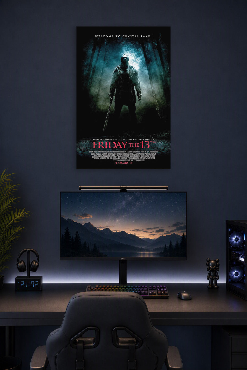 Friday the 13th Jason Voorhees in a gaming desk setup above a monitor.