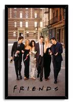 Friends framed wall art print featuring six cast members strolling in formal wear, with the dotted Friends logo at the bottom.