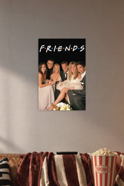 Friends TV Show Cast in a cozy movie room above a brown sofa with popcorn.