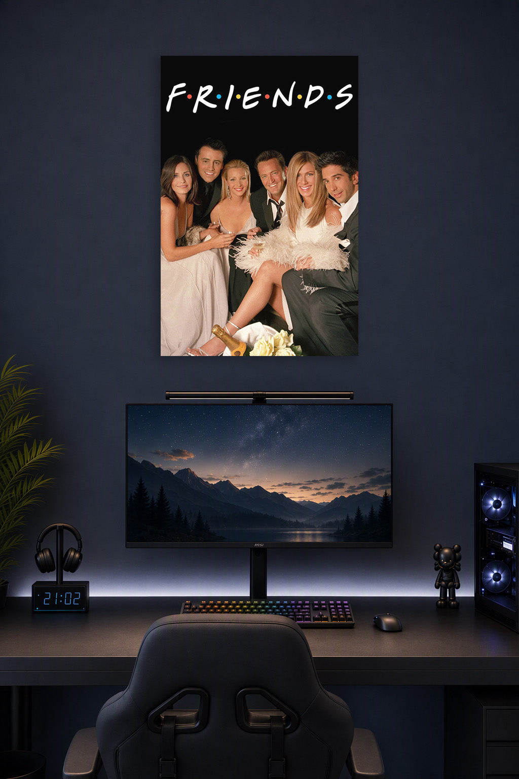 Friends TV Show Cast in a gaming desk setup above a monitor.