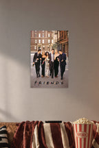 Friends TV Show Cast in a cozy movie room above a brown sofa with popcorn.