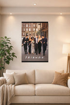 Friends TV Show Cast in a bright living room above a beige sofa.