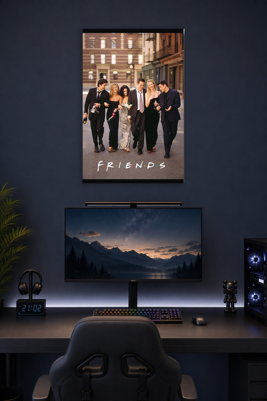 Friends TV Show Cast in a gaming desk setup above a monitor.