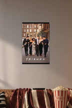 Friends TV Show Cast in a cozy movie room above a brown sofa with popcorn.