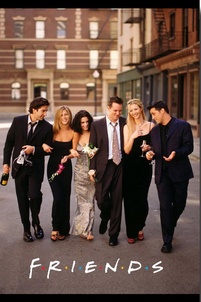 Friends poster features the six cast members walking arm in arm on a city street in formal outfits, with the series logo below.