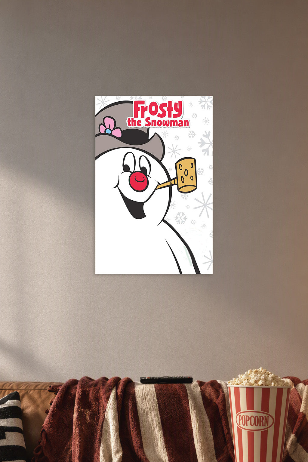 Frosty the Snowman in a cozy movie room above a brown sofa with popcorn.