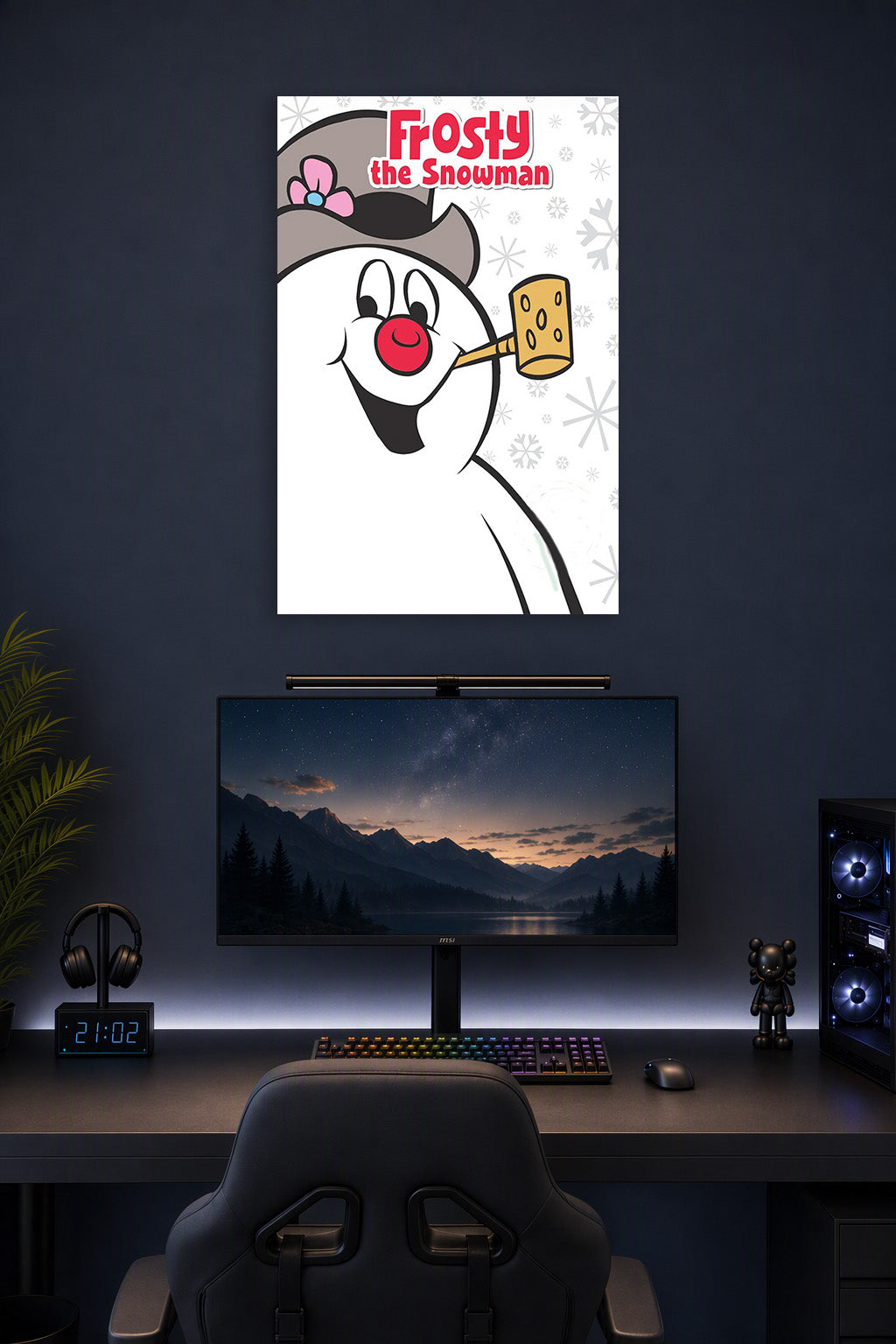 Frosty the Snowman in a gaming desk setup above a monitor.
