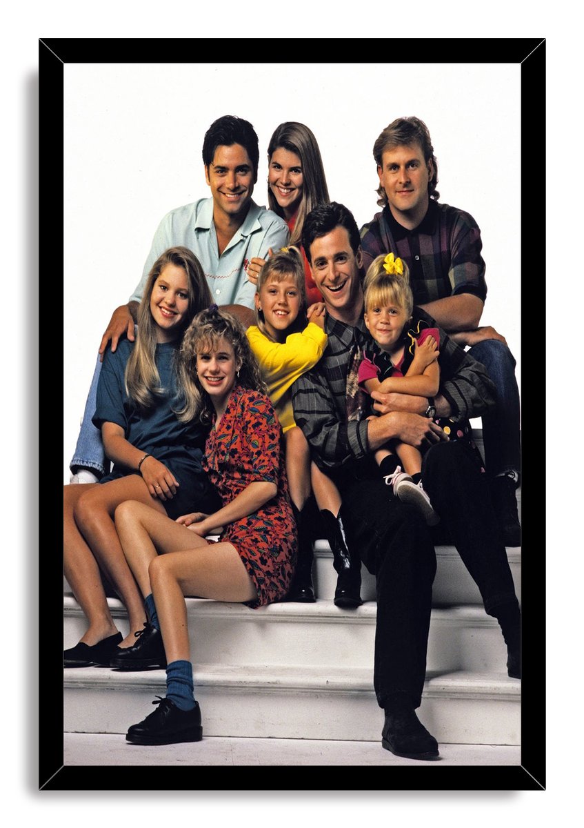 Full House cast framed wall art print presents the smiling ensemble portrait on white steps within a black frame.