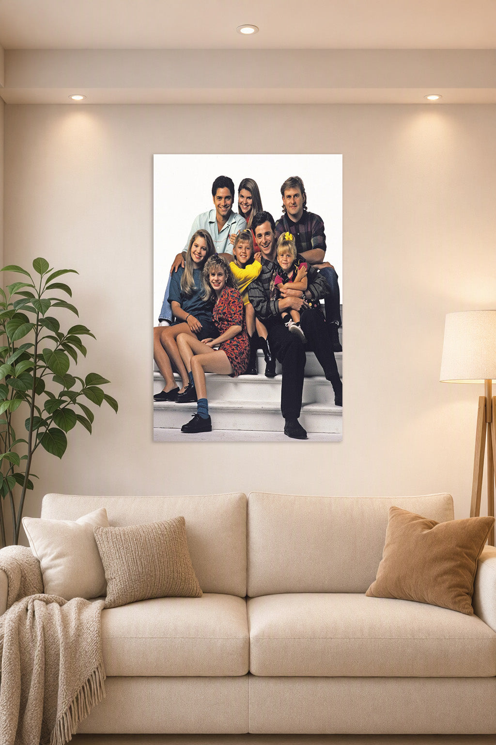 Full House Cast Family in a bright living room above a beige sofa.