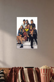 Full House Cast Family in a cozy movie room above a brown sofa with popcorn.