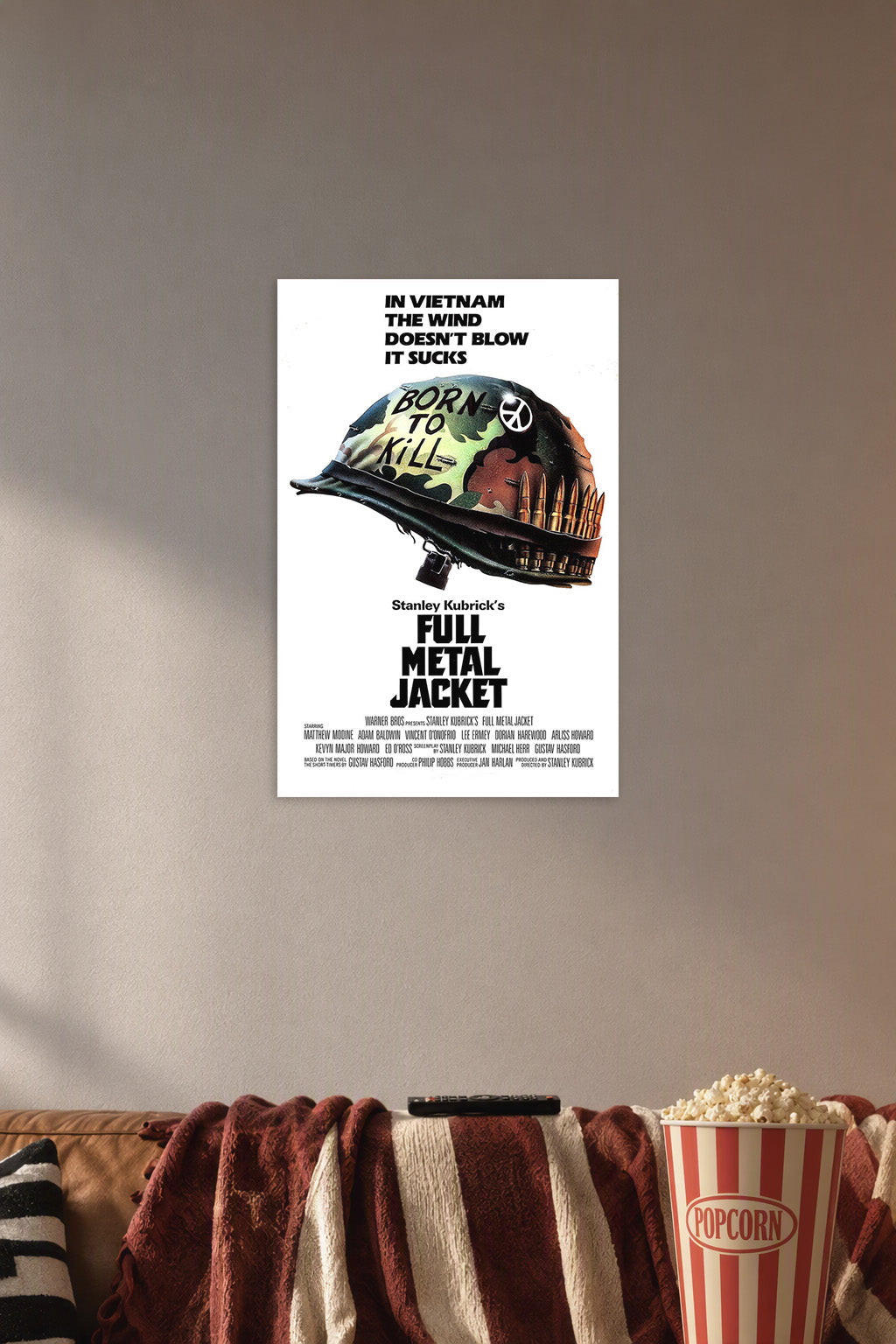 Full Metal Jacket Movie Poster in a cozy movie room above a brown sofa with popcorn.