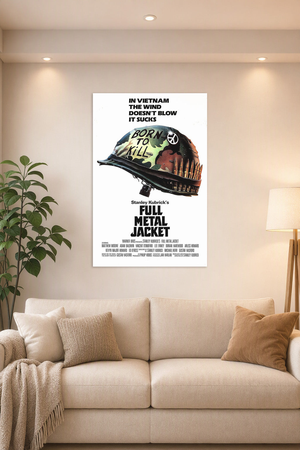 Full Metal Jacket Movie Poster in a bright living room above a beige sofa.