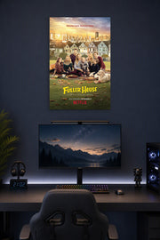 Fuller House Family Cast in a gaming desk setup above a monitor.