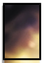 Fullmetal Alchemist wall art print is presented in a slim black frame around a softly blurred dark purple and golden background.