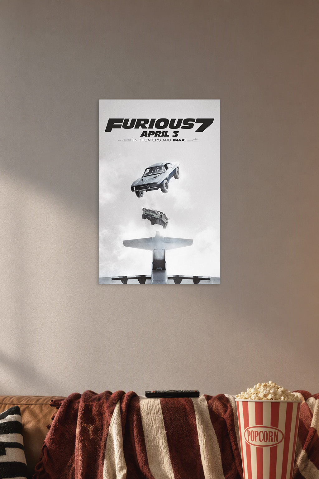 Furious 7 Movie Poster Cars Falling in a cozy movie room above a brown sofa with popcorn.