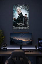 Gellert Grindelwald in a gaming desk setup above a monitor.