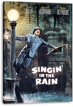 Singin' in the Rain wall art canvas featuring Gene Kelly in rain-soaked gray attire dancing by a lamp, with bold title lettering.
