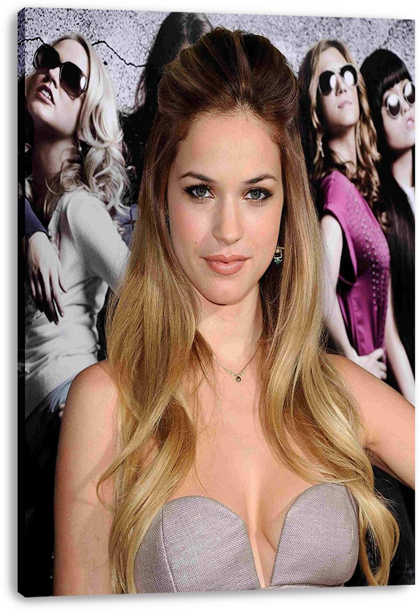 Genesis Rodriguez canvas wall art print featuring her silver dress portrait with women in sunglasses behind her.