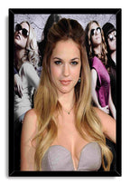Genesis Rodriguez framed wall art print with a black border, silver dress portrait, and fashion group backdrop.
