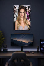 Genesis Rodriguez in a gaming desk setup above a monitor.