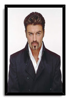 George Michael framed wall art print presents a centered portrait in a black frame, with dark jacket and white shirt.
