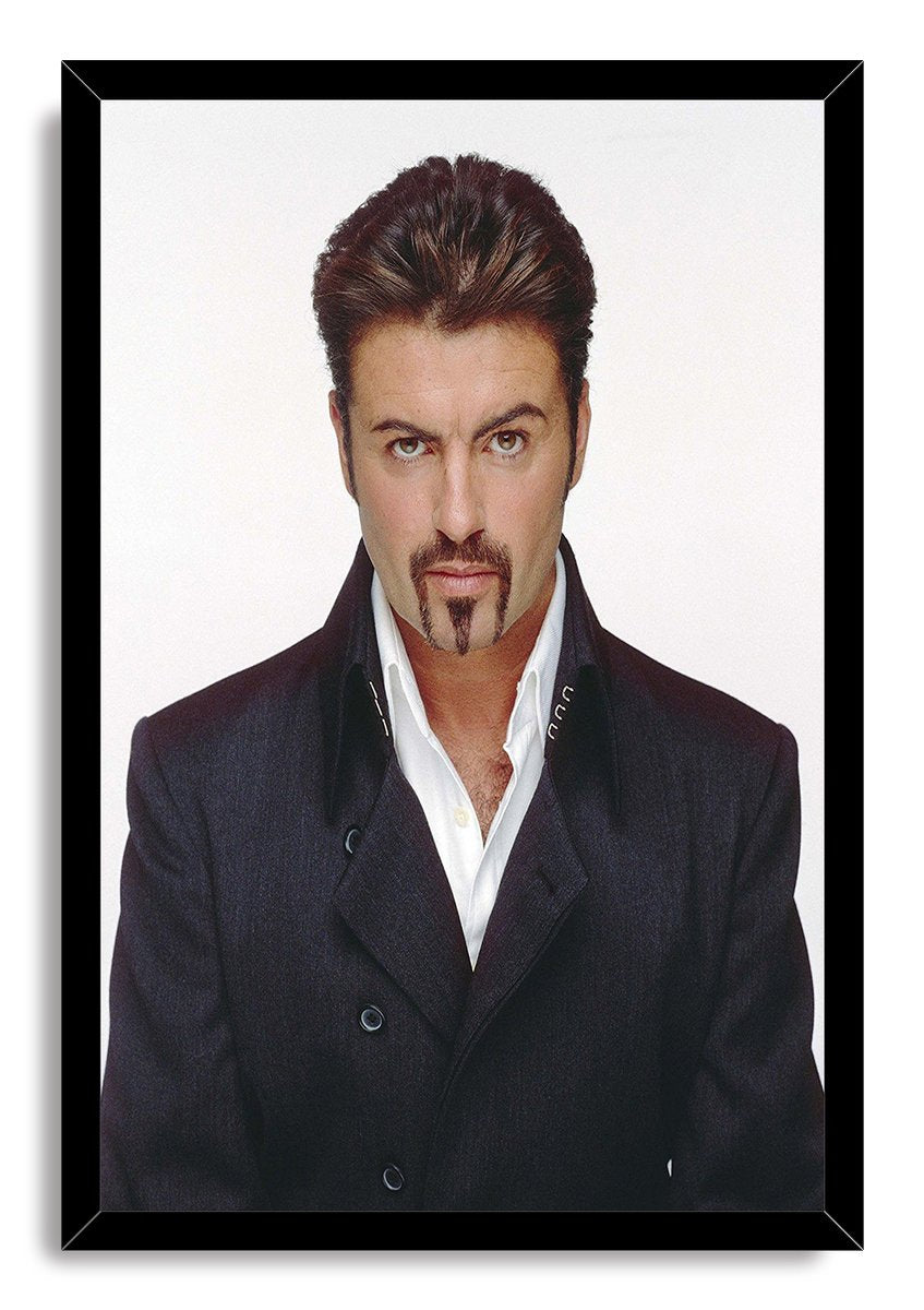 George Michael framed wall art print displays a front-facing portrait in a dark tailored coat within a black frame.