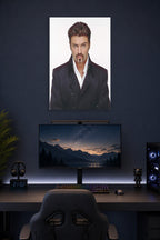 George Michael in a gaming desk setup above a monitor.