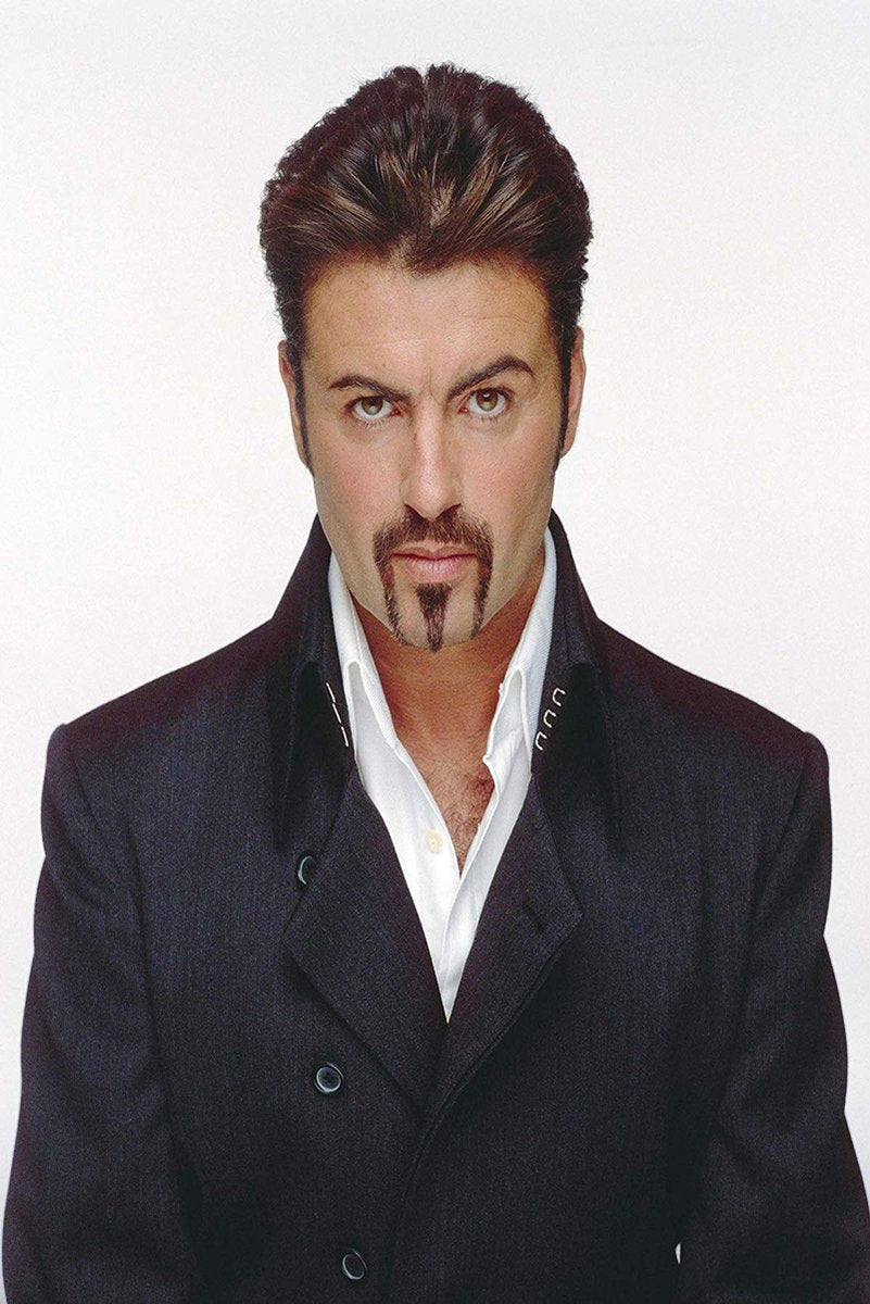 George Michael poster features a front-facing portrait in a dark double-breasted coat and open white shirt on white.