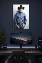 George Strait in a gaming desk setup above a monitor.