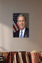 George W. Bush in a cozy movie room above a brown sofa with popcorn.