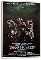 Ghostbusters canvas wall art print with white wrapped edges, three ghost hunters in gray jumpsuits, and bold title text.