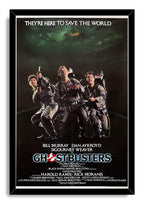 Ghostbusters framed wall art print in a black frame, featuring three proton-pack-equipped men beneath dark green clouds.