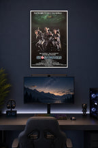 Ghostbusters in a gaming desk setup above a monitor.